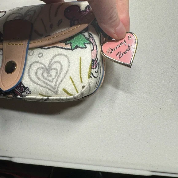 Dooney & Bourke Disney World small bag or‎ wallet.